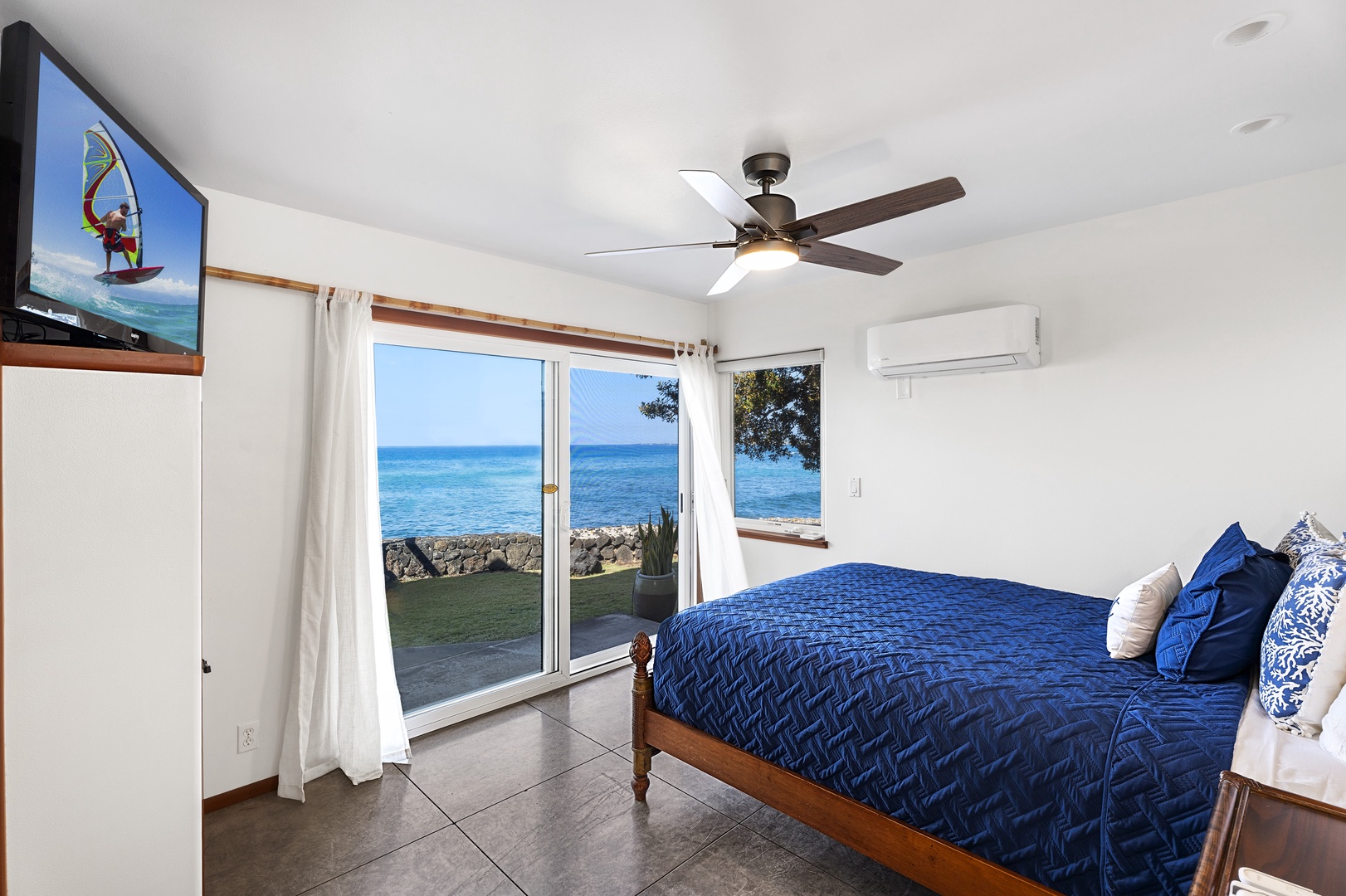 Kailua-Kona Vacation Rentals, Hale Kope Kai - Downstairs guest bedroom equipped with Queen bed, A/C, Lanai, and ensuite