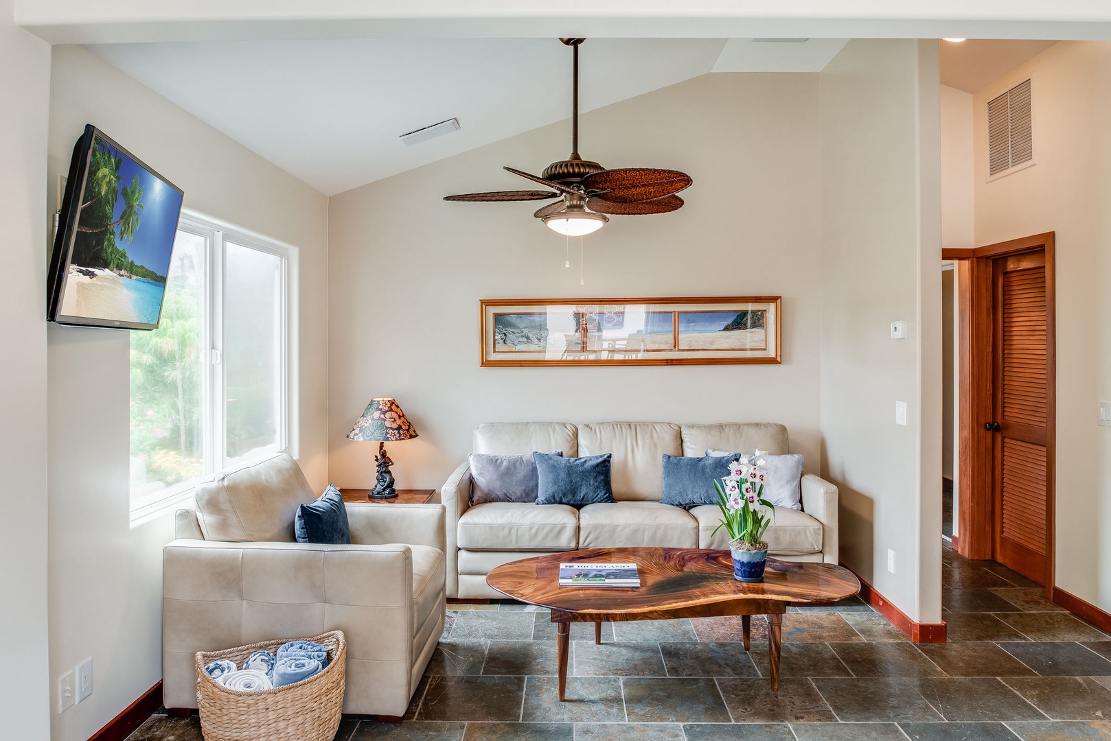 Kailua Kona Vacation Rentals, Kona Beach Bungalows** - Sink into comfort in Kahakai's living area, adorned with plush sofas for ultimate relaxation.
