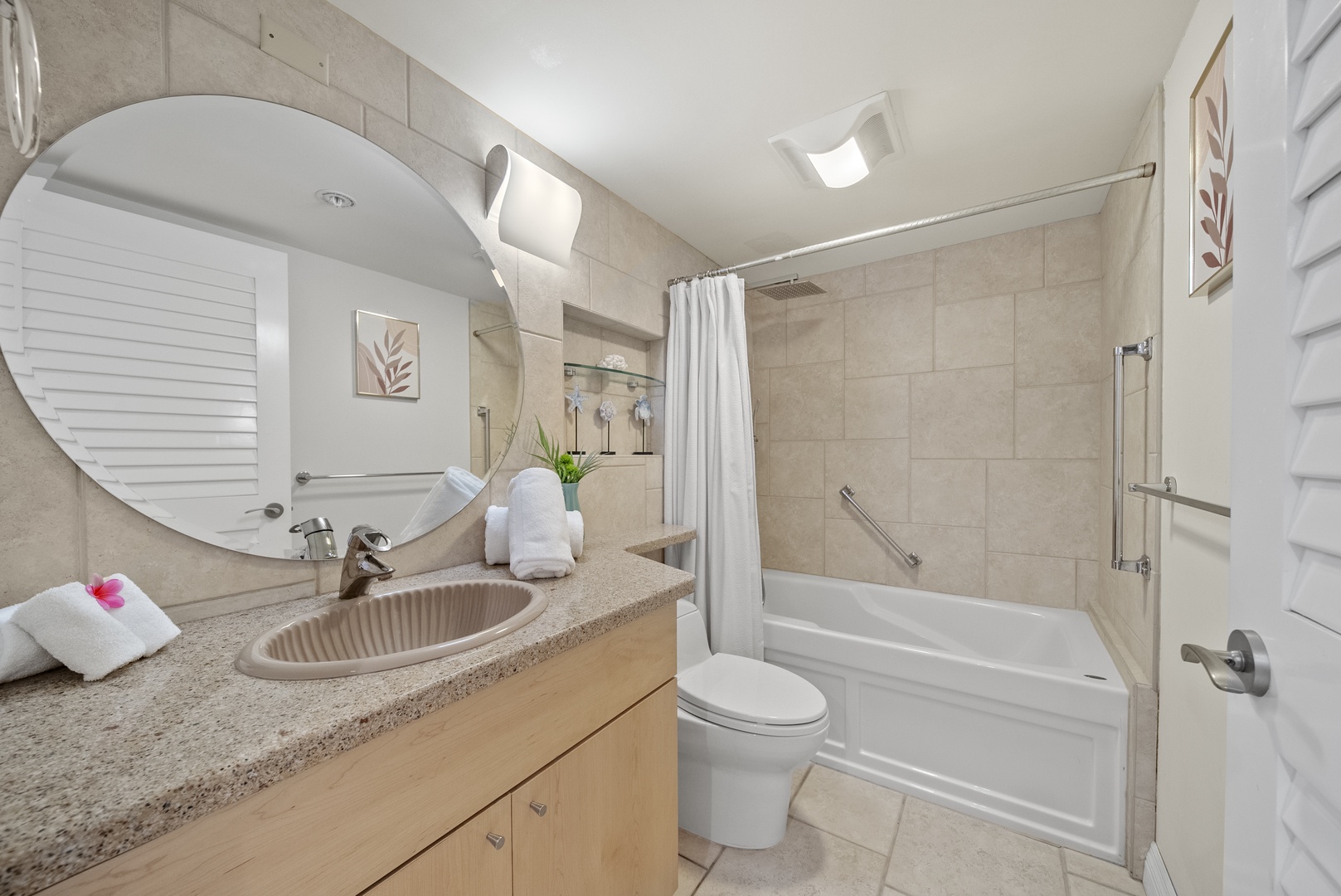 Honolulu Vacation Rentals, Aston Waikiki Beach Tower 602 - Guest bathroom that combines comfort with timeless style.