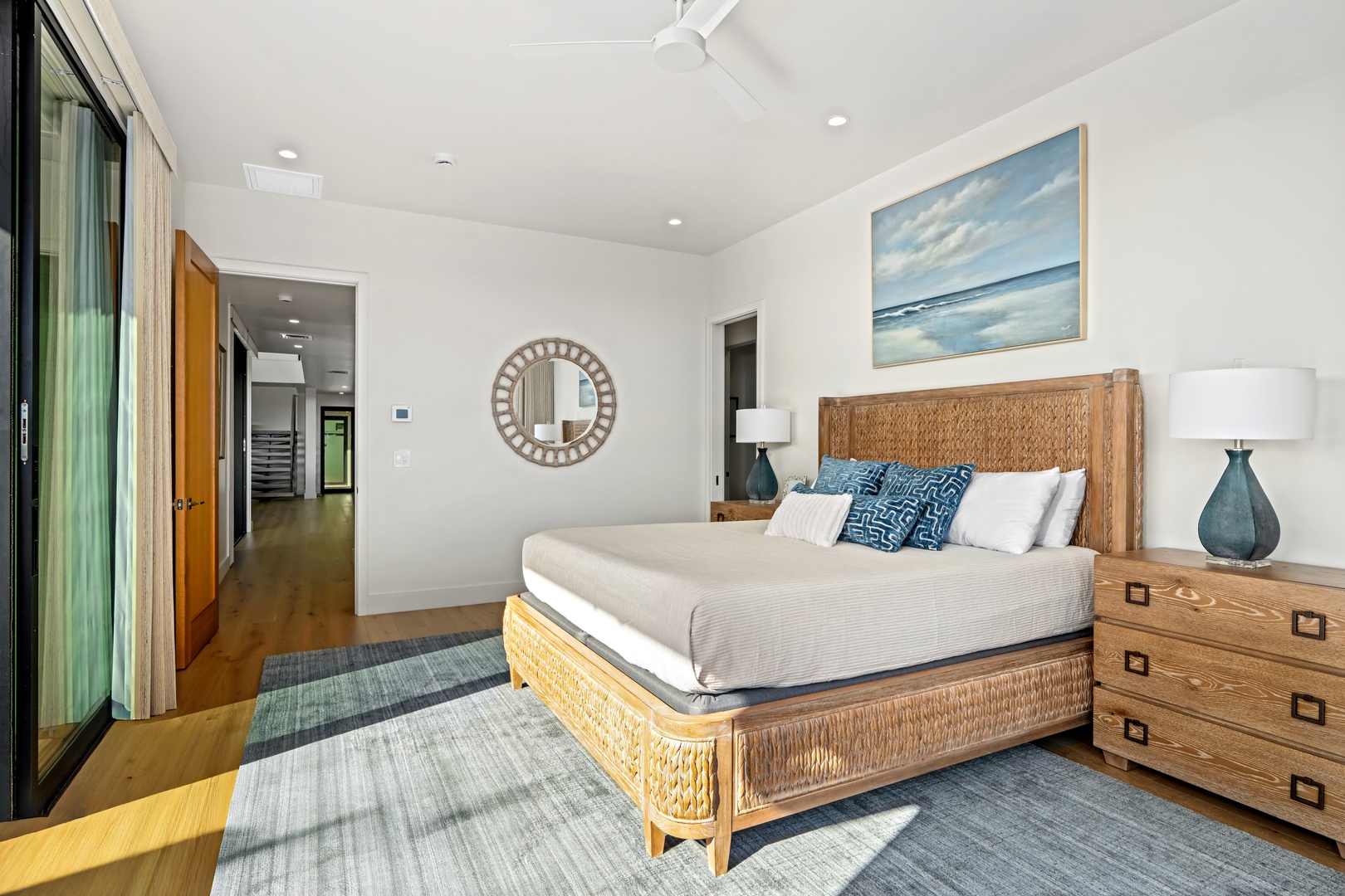 Koloa Vacation Rentals, Hale Laule'a at Kukui'ula - Unwind in your coastal-inspired bedroom with natural textures and ocean artwork that create the perfect peaceful retreat.