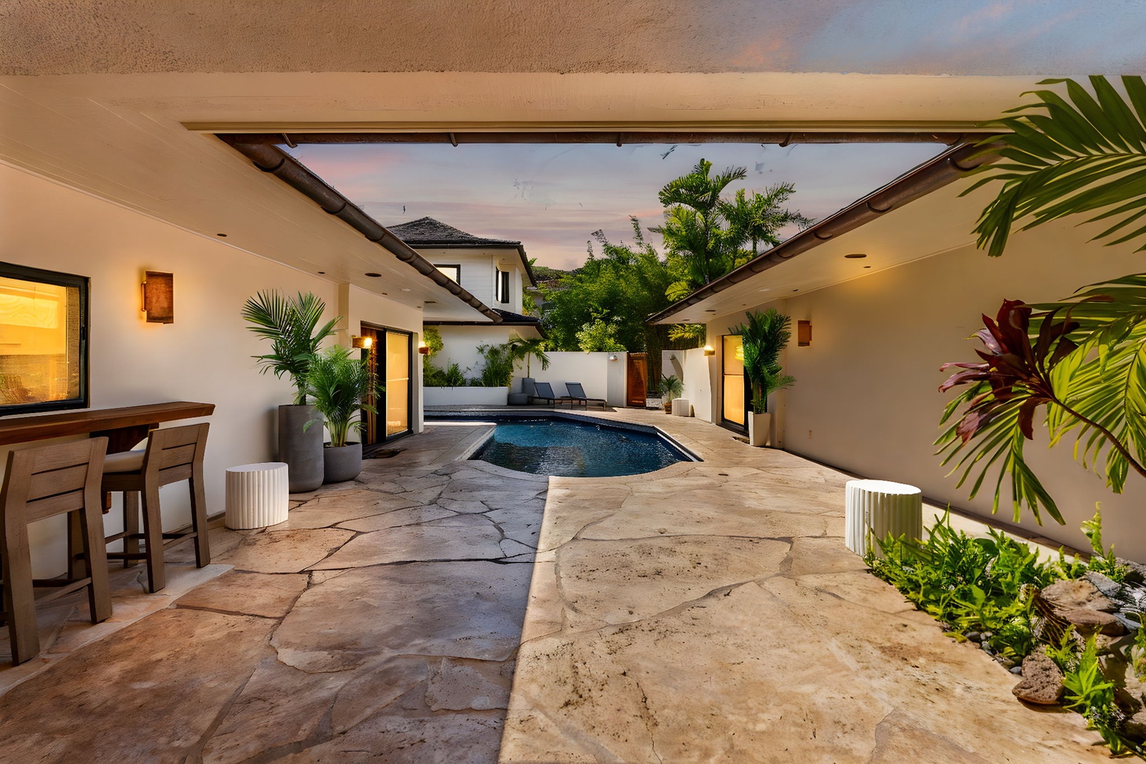 Honolulu Vacation Rentals, Honolulu Lagoonfront Villa - Step into your private courtyard oasis, where the pool glows in the golden dusk light—ideal for a refreshing dip before an al fresco dinner.