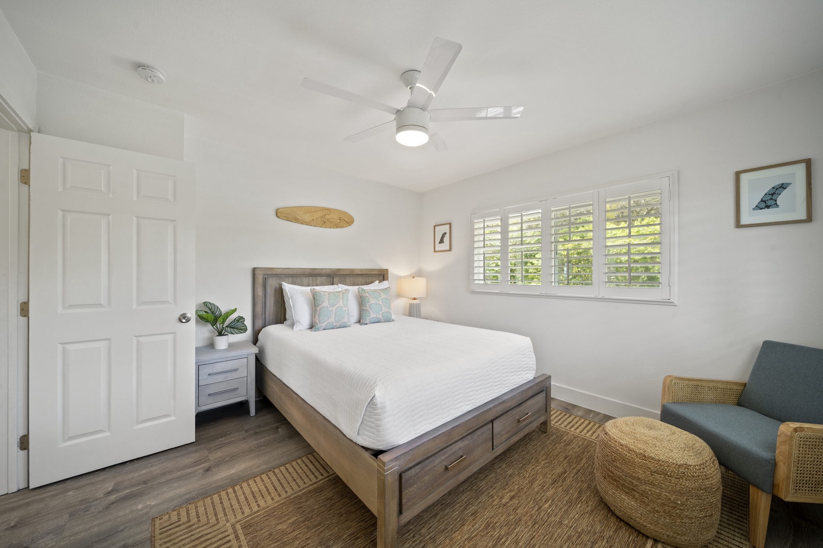 Haleiwa Vacation Rentals, Hale Nalu - Guest Bedroom 5 has a queen size bed, ceiling fan, and split A/C