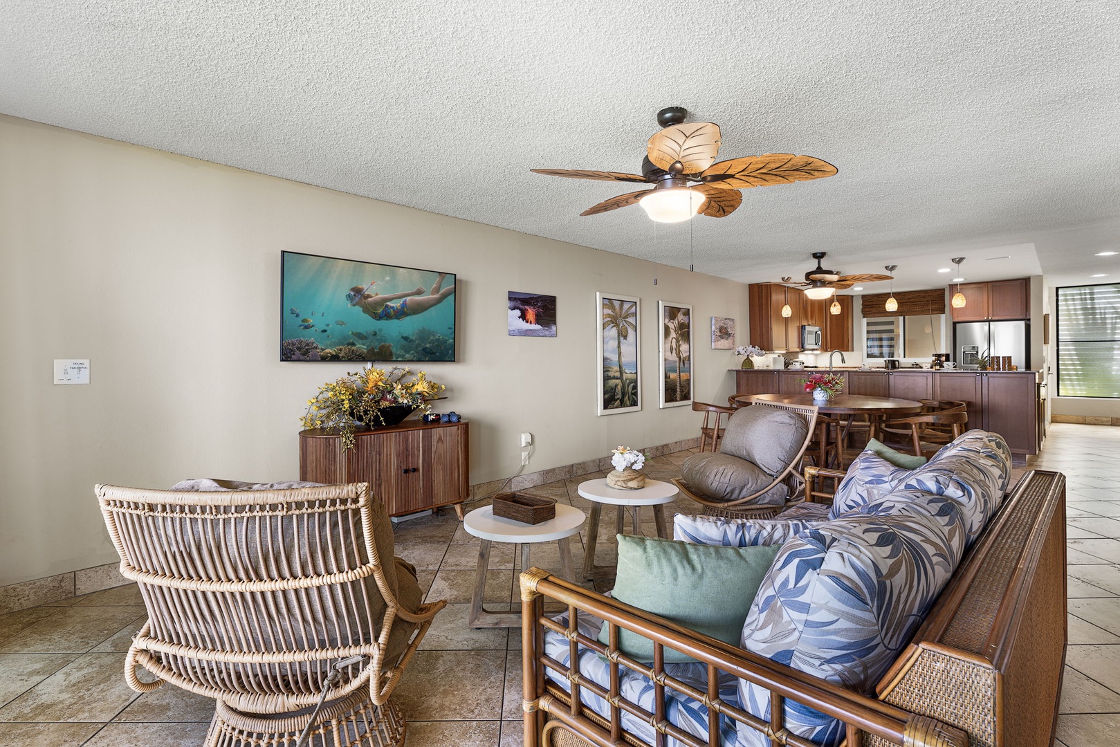 Kailua Kona Vacation Rentals, Keauhou Kona Surf & Racquet 1104 - Rattan chairs, a soft sofa, and the water doing the entertaining beyond the glass.