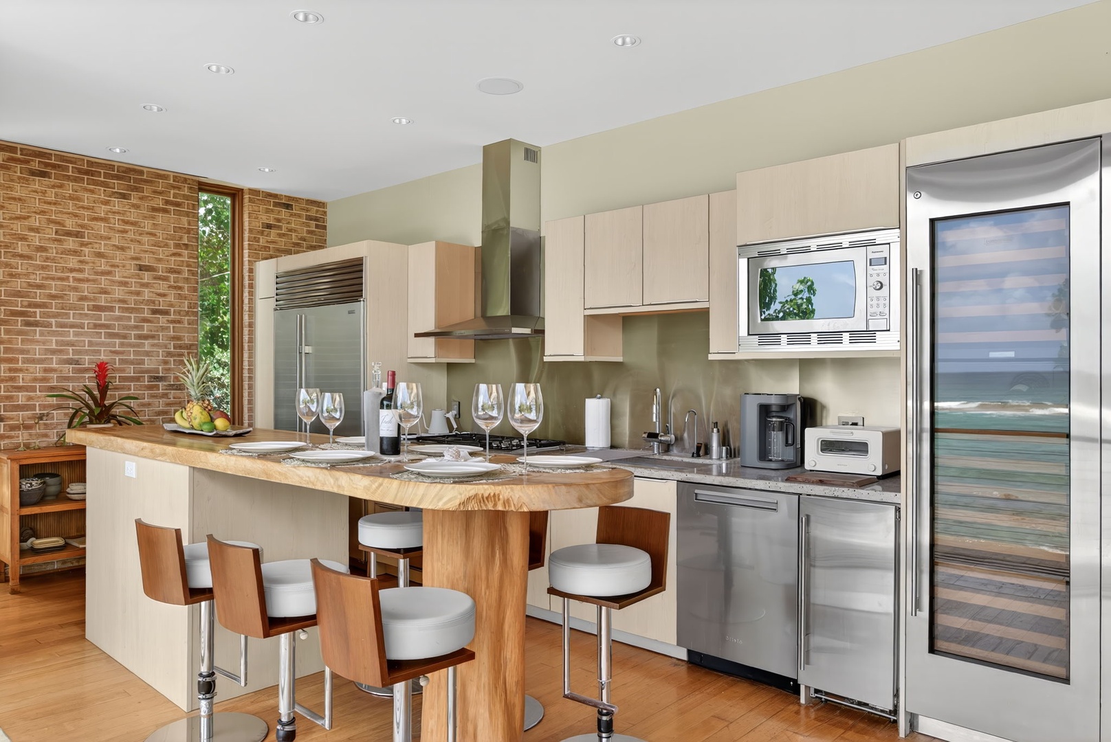 Haleiwa Vacation Rentals, HaleGator - The chef-ready kitchen features premium appliances, custom cabinetry, granite countertops, and generous seating for gathering together.