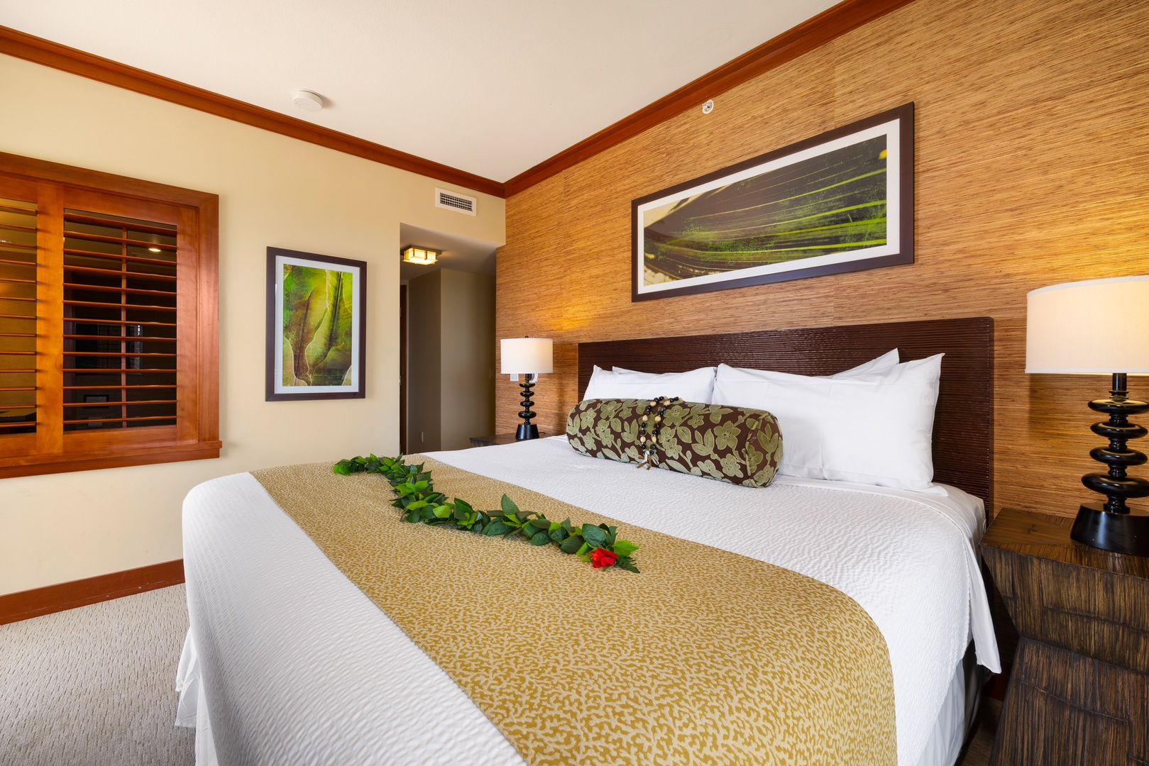 Kapolei Vacation Rentals, Ko Olina Beach Villas O1111 - Sink into crisp white linens and warm wood tones in your peaceful bedroom retreat, where tropical touches create the perfect escape.