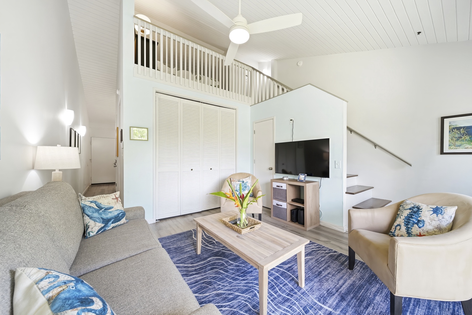 Kahuku Vacation Rentals, Kuilima Estates West #132 - Settle into the sofa after a North Shore day, TV and ceiling fan close at hand.
