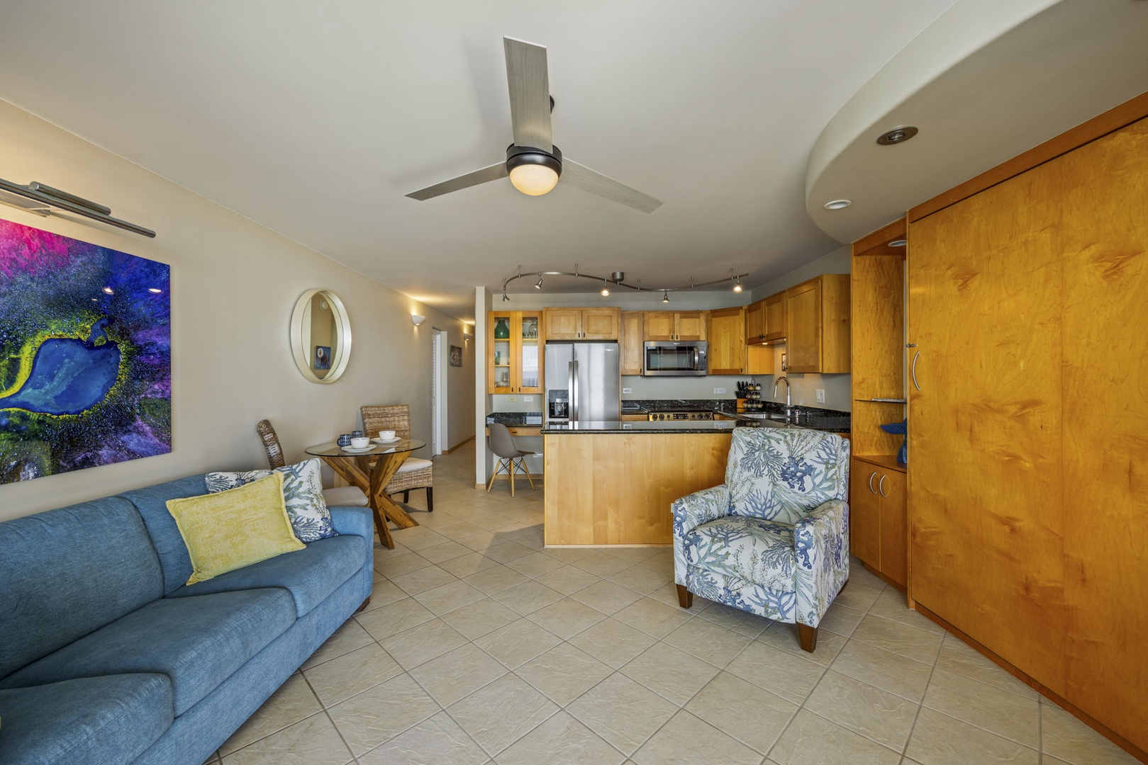 Wailuku Vacation Rentals, Milowai 310 - Choose the wicker chair or the floral armchair, kitchen and wall bed both in easy reach from either one.