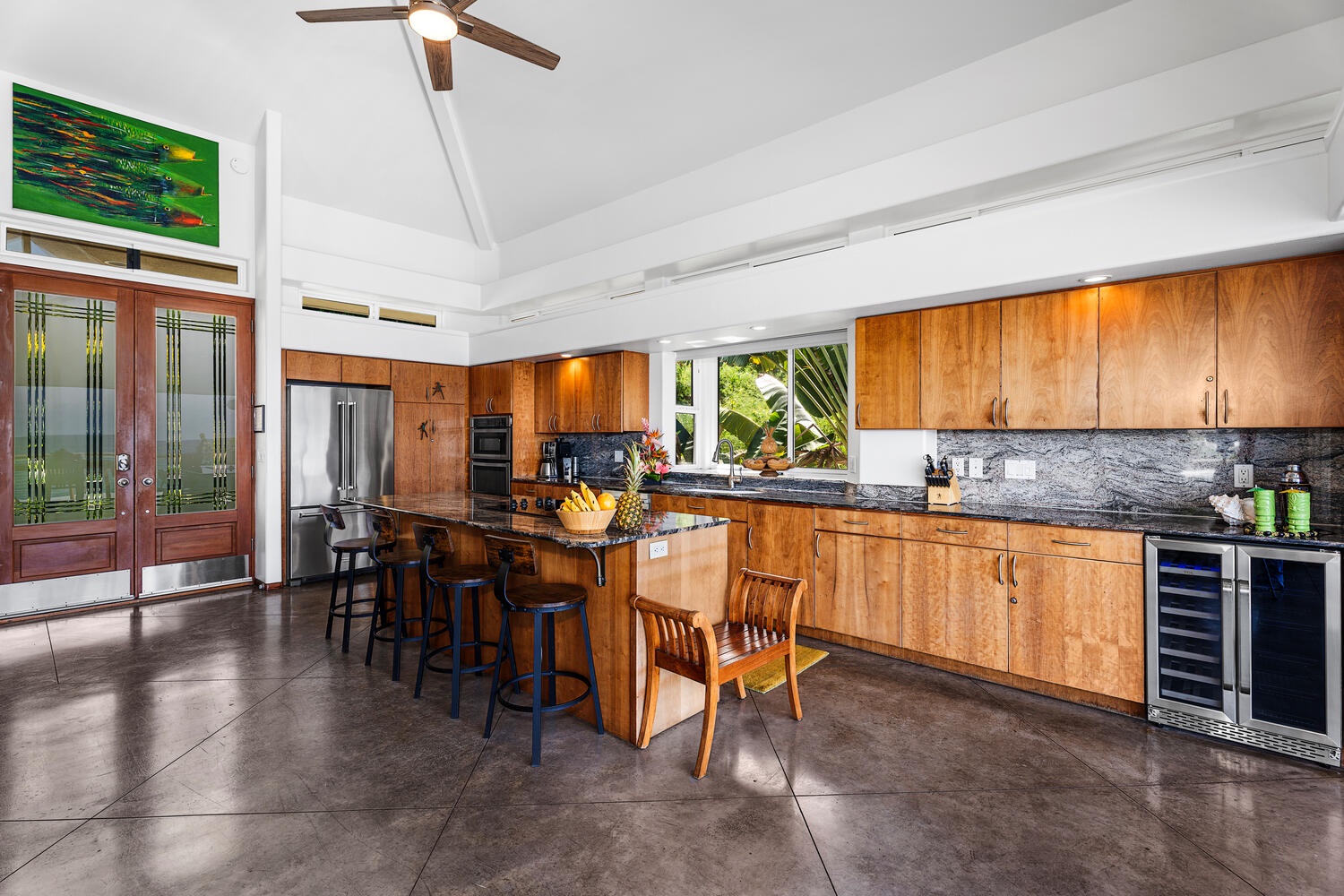 Kailua-Kona Vacation Rentals, Hale Kope Kai - Spacious chef’s kitchen with island seating and seamless flow to oceanview dining.