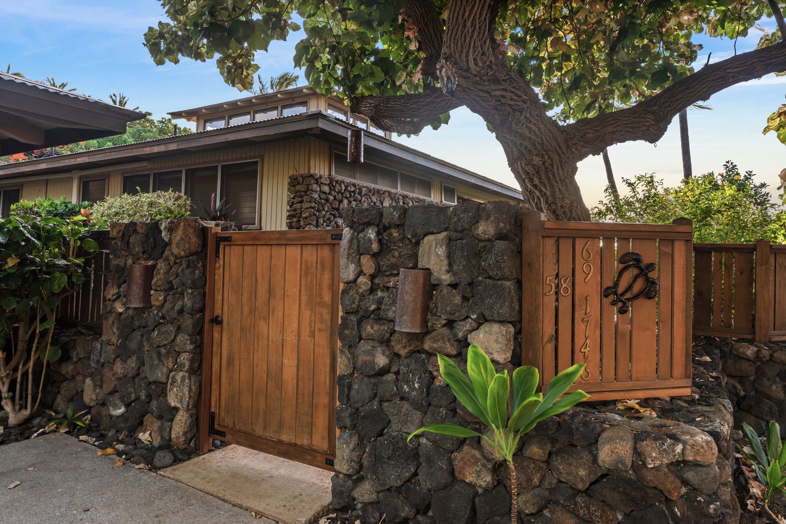 Kamuela Vacation Rentals, Island Time Retreat - A wood gate in the rock wall keeps the property tucked away from the lane.
