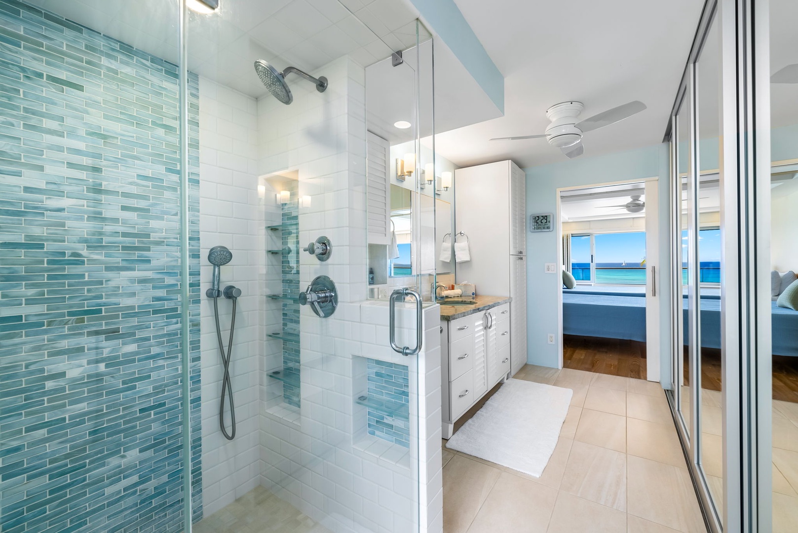 Honolulu Vacation Rentals, Colony Surf Luxe - Glass-enclosed shower with dual heads and beachy accents—rejuvenate after a swim or rinse off the day’s adventures.