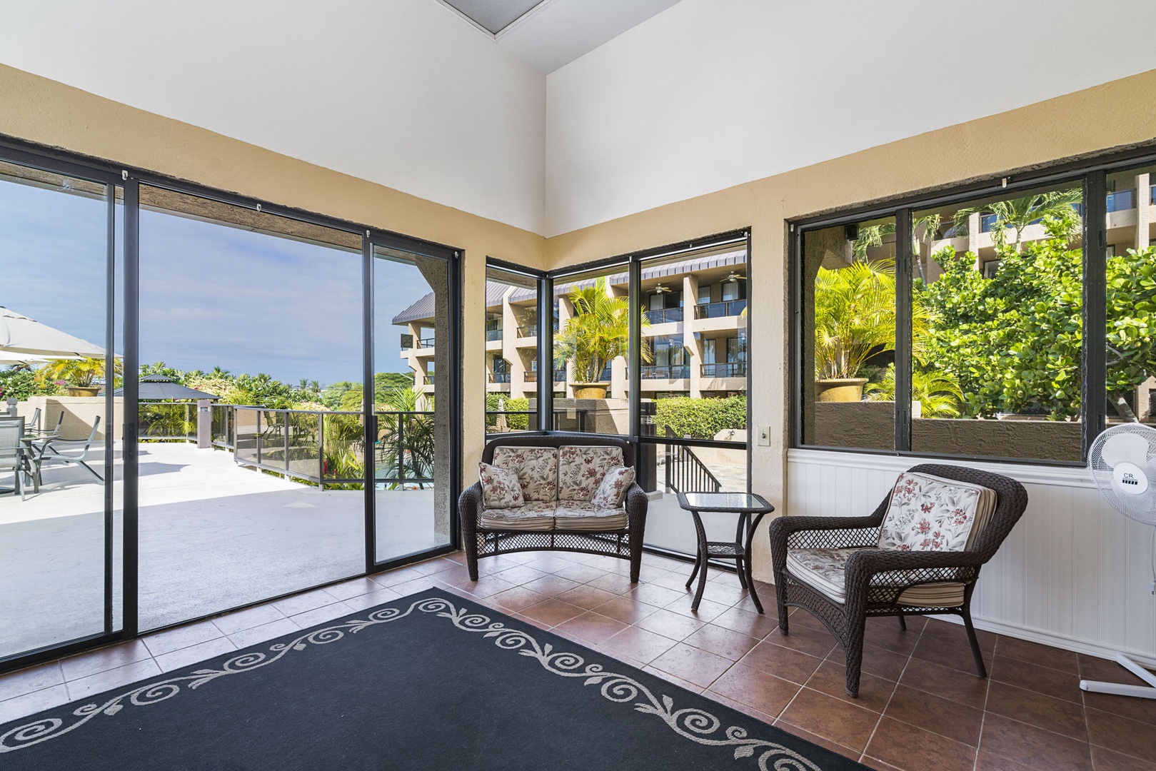 Kailua Kona Vacation Rentals, Kona Pacific C416 - Common Area Bright and airy living space with modern furnishings and patio access.