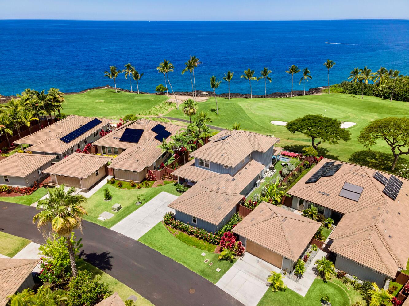 Kailua-Kona Vacation Rentals, Holua Kai #26 - Overhead view of a charming neighborhood set against a backdrop of a vibrant golf course and the deep blue ocean.