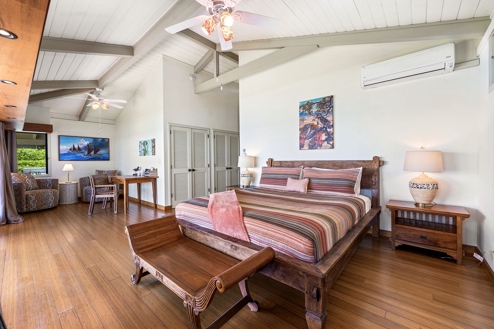 Kamuela Vacation Rentals, Island Time Retreat - A wood-framed bed and its own sitting nook, room to settle in for the week.