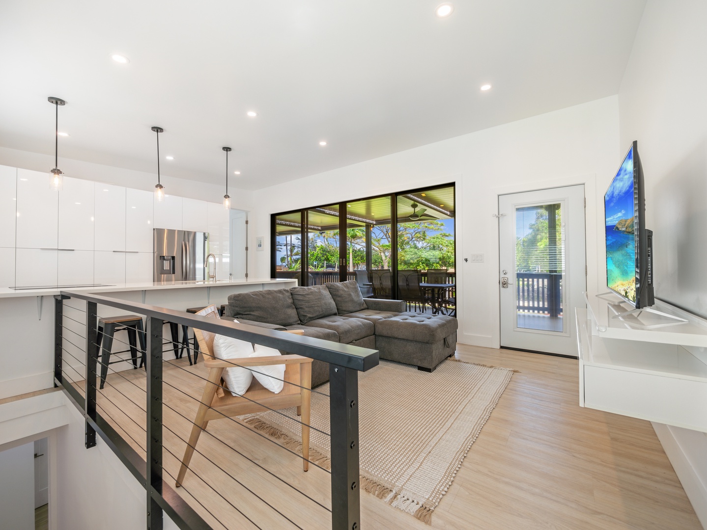 Haleiwa Vacation Rentals, Sunset Beach Island Retreat - The open-concept living space seamlessly connects to the outdoor lanai, creating a perfect blend of indoor and outdoor living