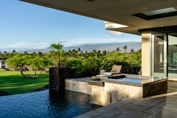 Kamuela Vacation Rentals, Champion Ridge 22 & 24 - Infinity pool and spa with serene views of the lush landscape, perfect for relaxing in a peaceful outdoor setting.