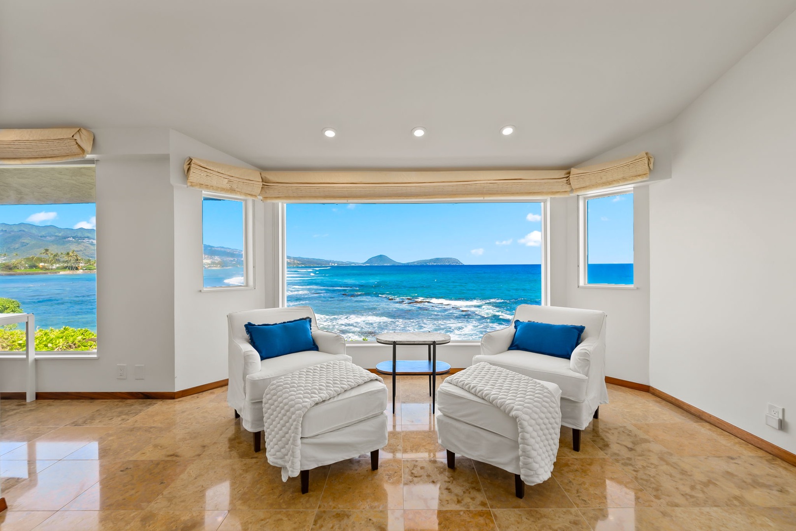 Honolulu Vacation Rentals, Black Point Ocean Villa - Settle into your private seating nook with stunning ocean panoramas through expansive windows—your perfect spot for morning coffee.