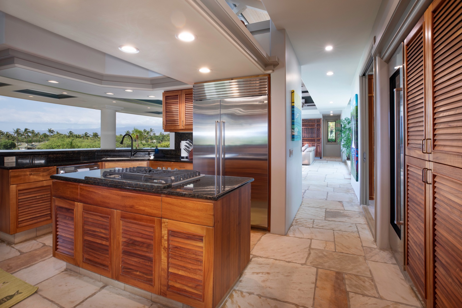 Kamuela Vacation Rentals, Canoe House at Champion Ridge - Spacious hallway and gourmet kitchen with Sub-Zero fridge and premium finishes.