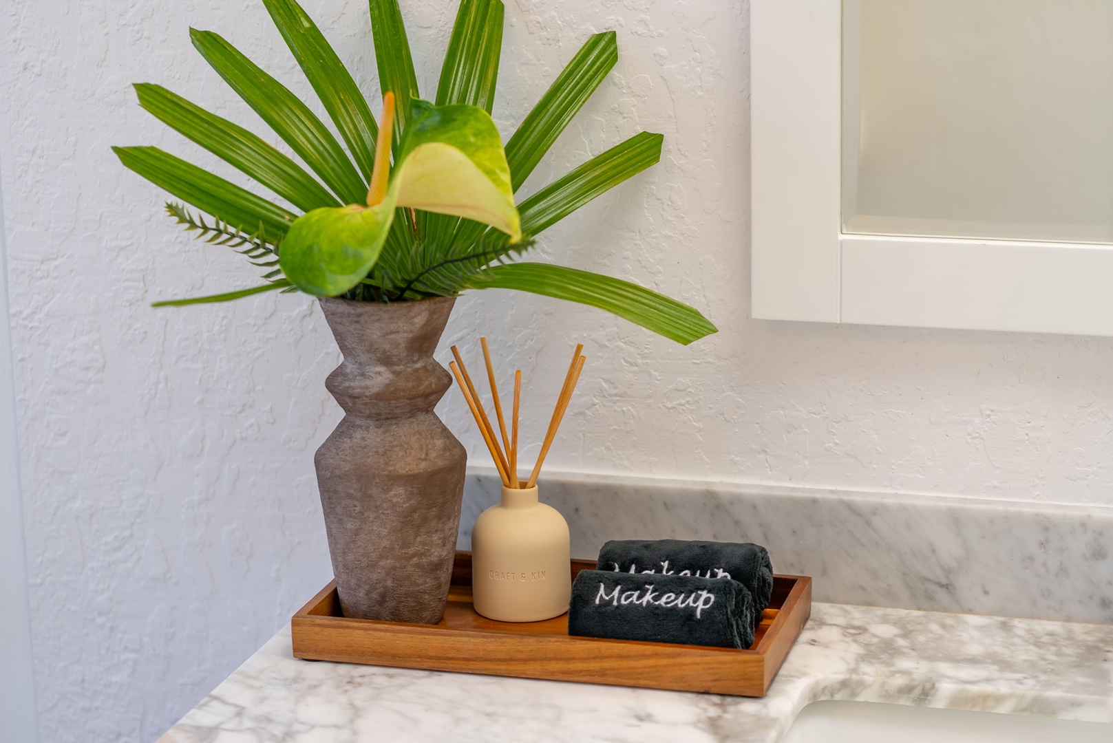 Honolulu Vacation Rentals, Ho'okipa Villa - Fresh tropical greenery and thoughtful touches welcome you to your bathroom, where every detail invites relaxation and care.