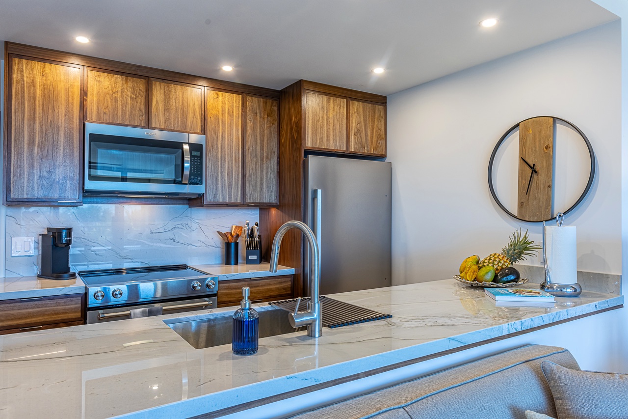 Kihei Vacation Rentals, Kamaole Beach Royal 610 - Full-size range, oven, and fridge stand ready for whatever the group wants to cook.