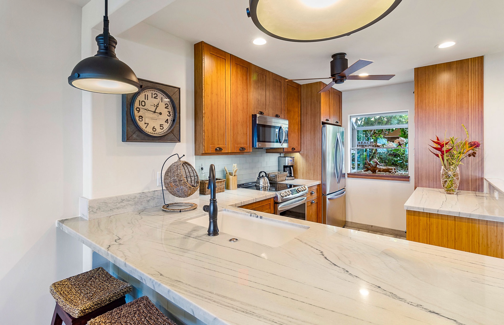 Lahaina Vacation Rentals, Puamana 240-3 - A thoughtfully designed dining area that combines modern style with tropical accents.