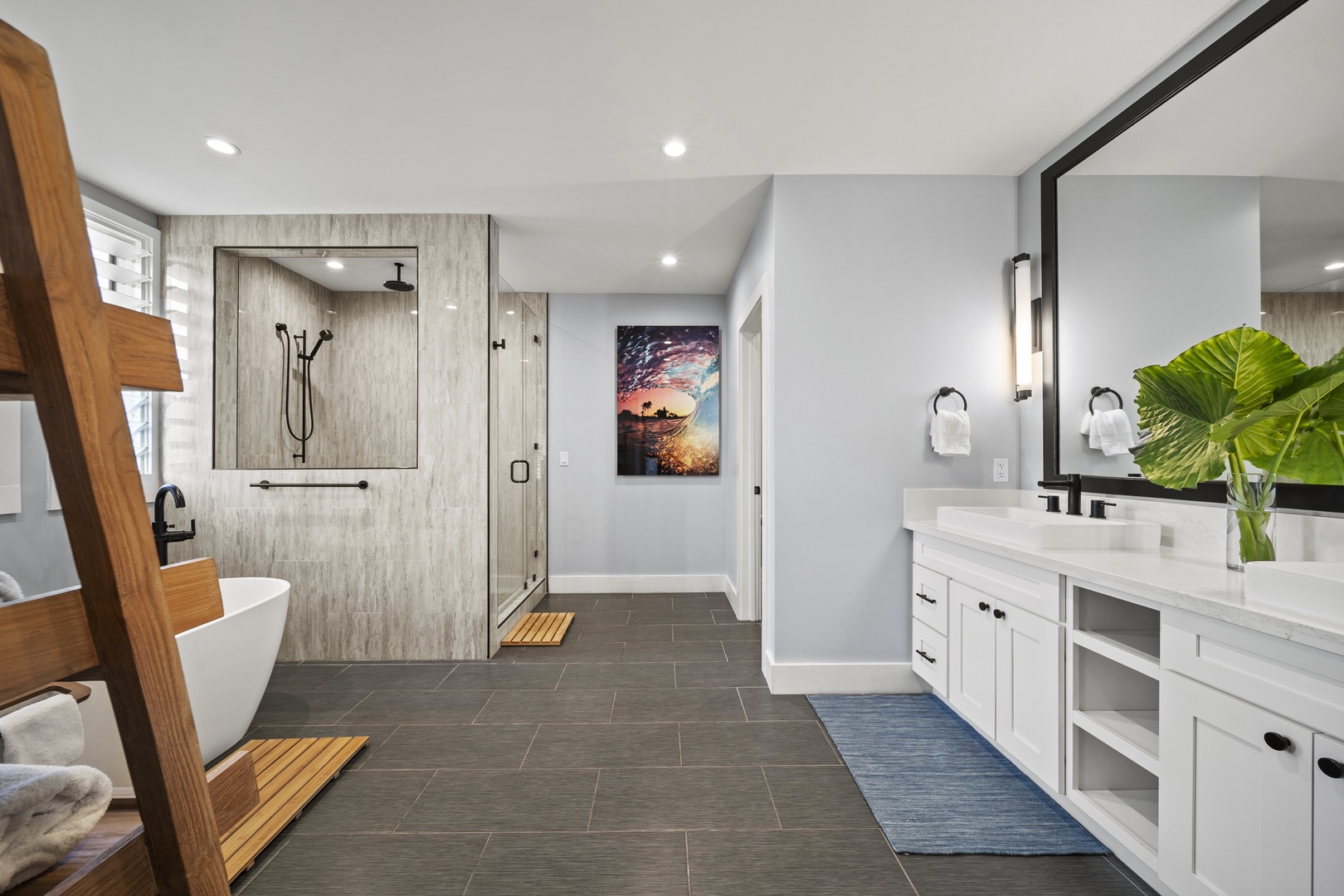 Haleiwa Vacation Rentals, Hale Mahina - Enjoy a bright, spacious bathroom with dual vanities, modern finishes, and a large walk-in shower.