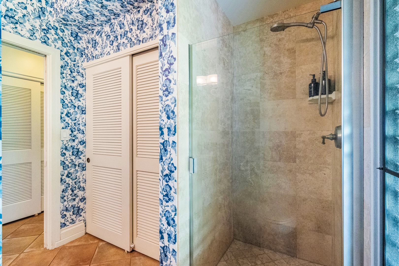 Kihei Vacation Rentals, Wailea Ekolu 1106 - Wailea Ekolu 1106 features a walk-in shower with bold blue wallpaper and bright, modern style.