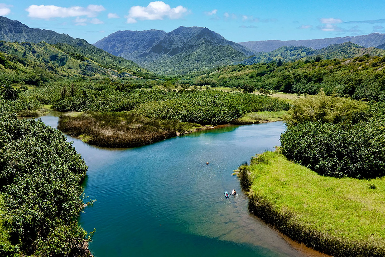 Koloa Vacation Rentals, Ke Kai Nui at Kukuiula - Tranquil Hanalei River surrounded by lush greenery and rolling mountains, ideal for kayaking or a peaceful stroll.