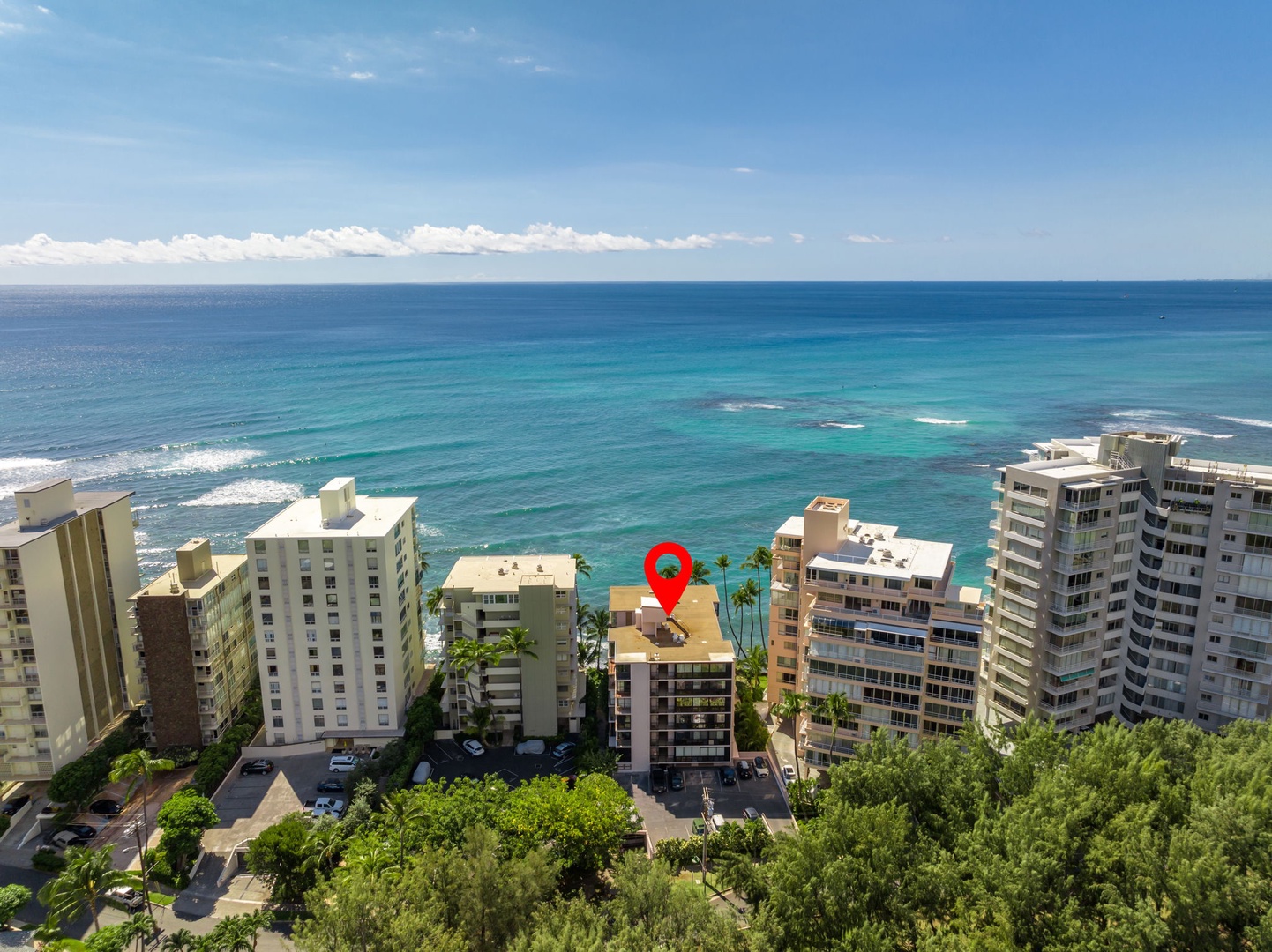 Honolulu Vacation Rentals, Kaimana Views - Aerial view of oceanfront property with sparkling blue waters, offering unparalleled access to the beach and vibrant island life.