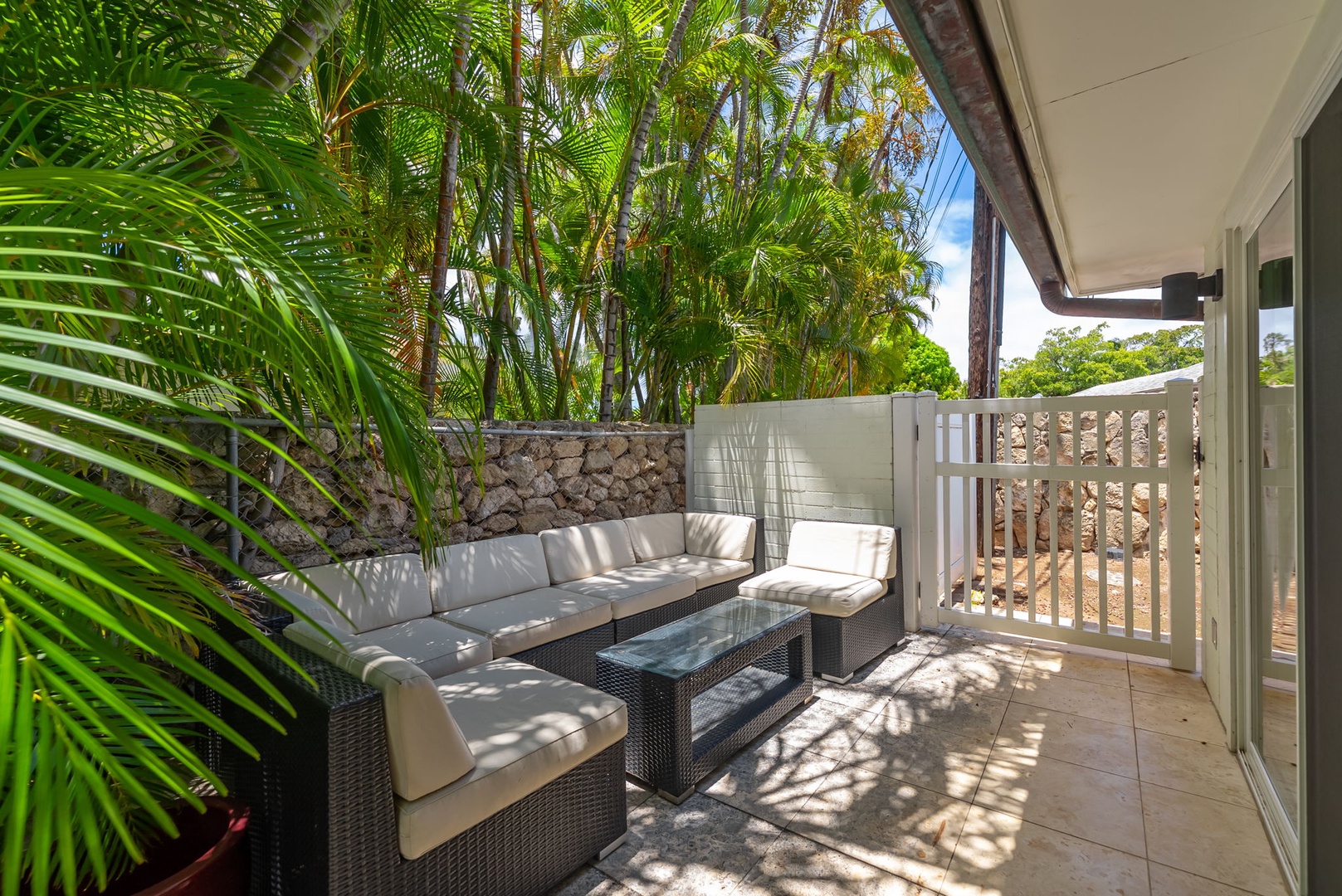 Honolulu Vacation Rentals, Kahala Lani - Private patio nook with sectional seating, ideal for quiet conversations.