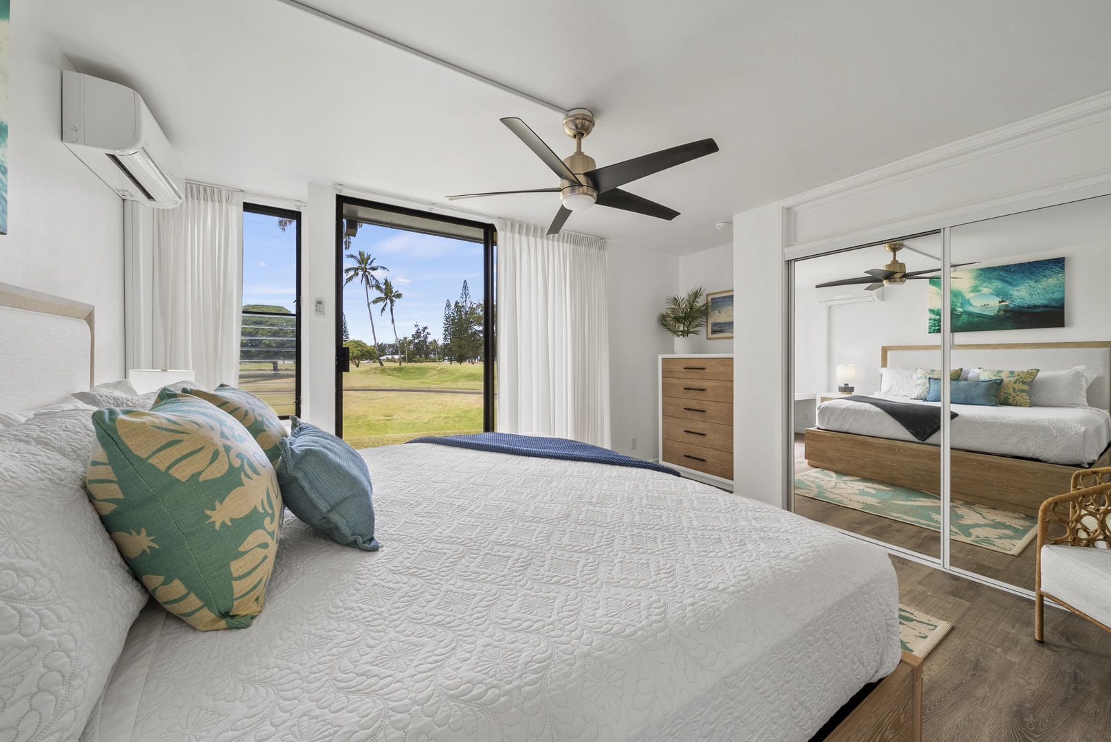 Kahuku Vacation Rentals, Kuilima Estates West #85 - Main downstairs bedroom with a king bed and reading nook to enjoy the views.