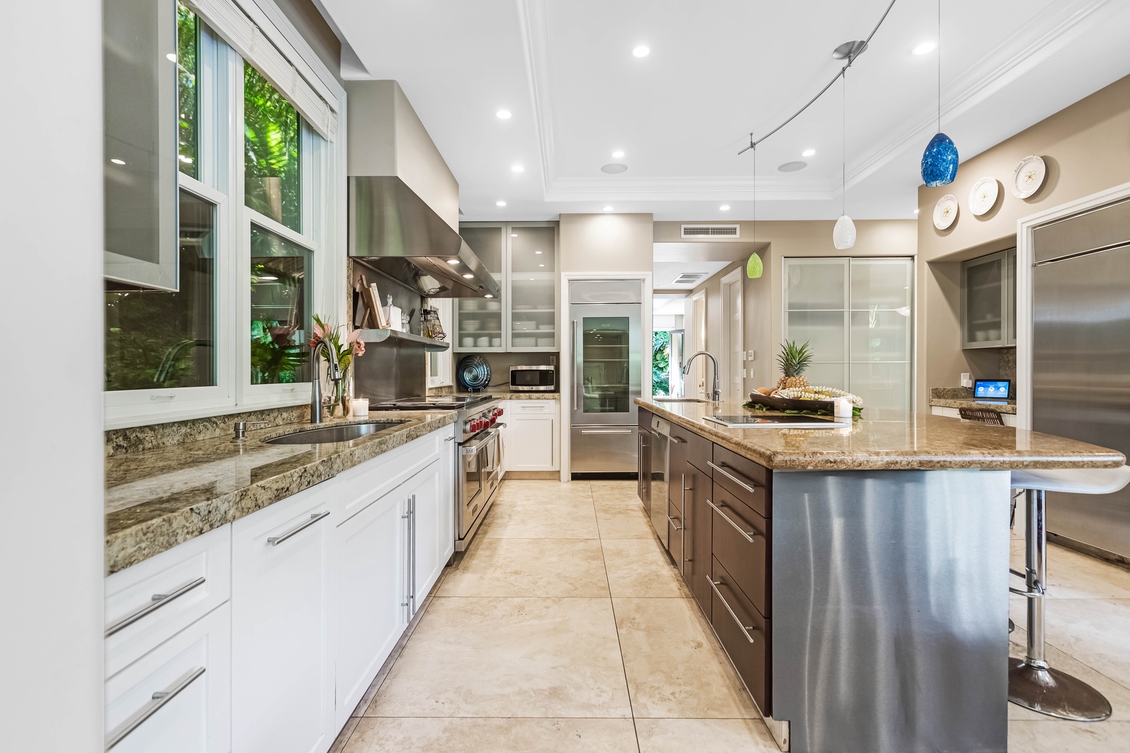 Honolulu Vacation Rentals, Pili Pono - Spacious galley-style kitchen with top appliances and storage.