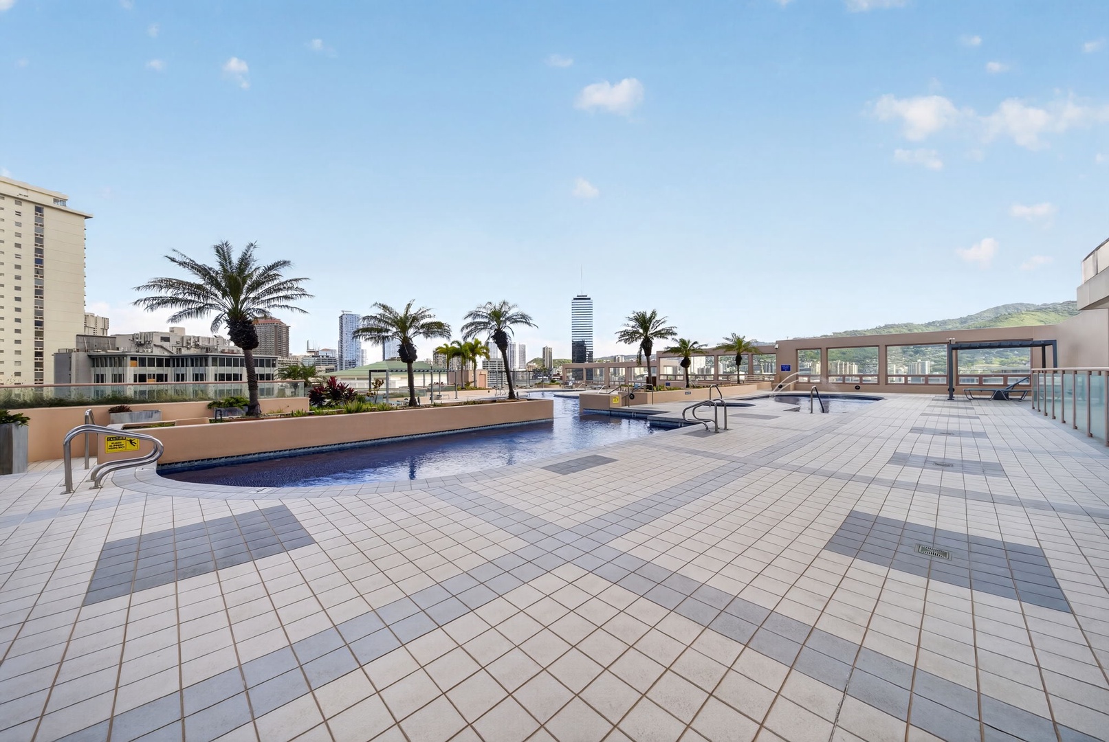 Honolulu Vacation Rentals, Island View at Waikiki Landmark - Lounge above the city on the expansive rooftop recreation deck with skyline views.