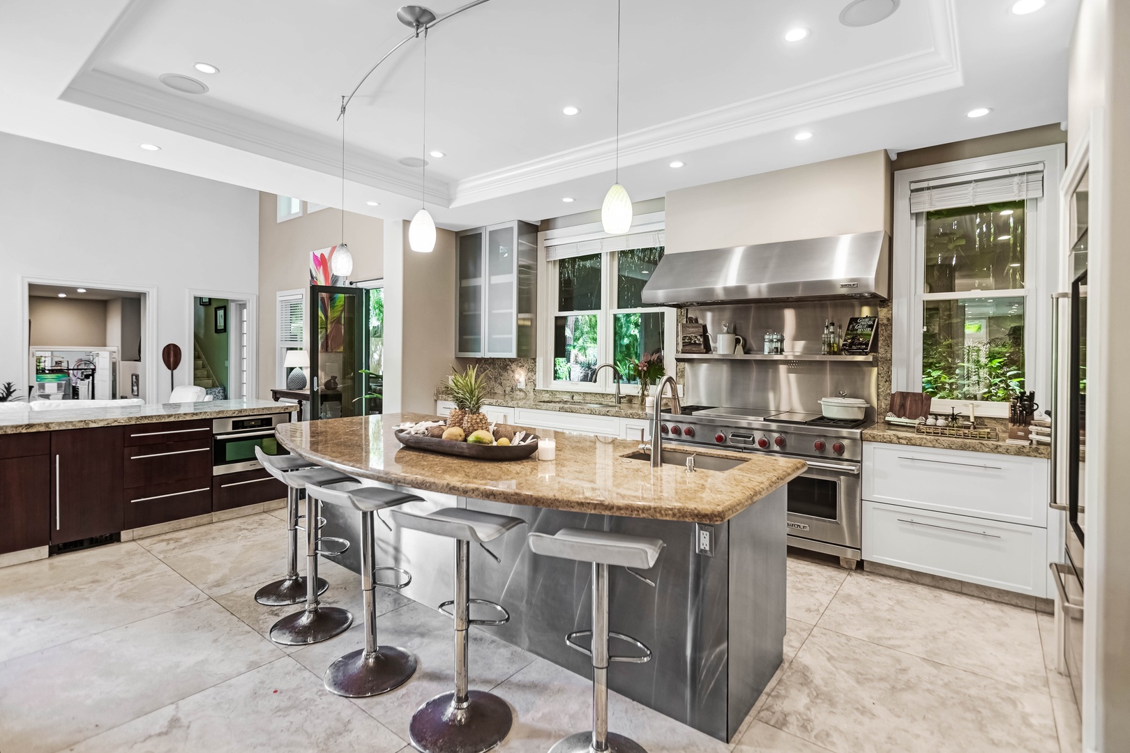 Honolulu Vacation Rentals, Pili Pono - Chef’s kitchen with dual islands, gas stove, and seating for your entire group.