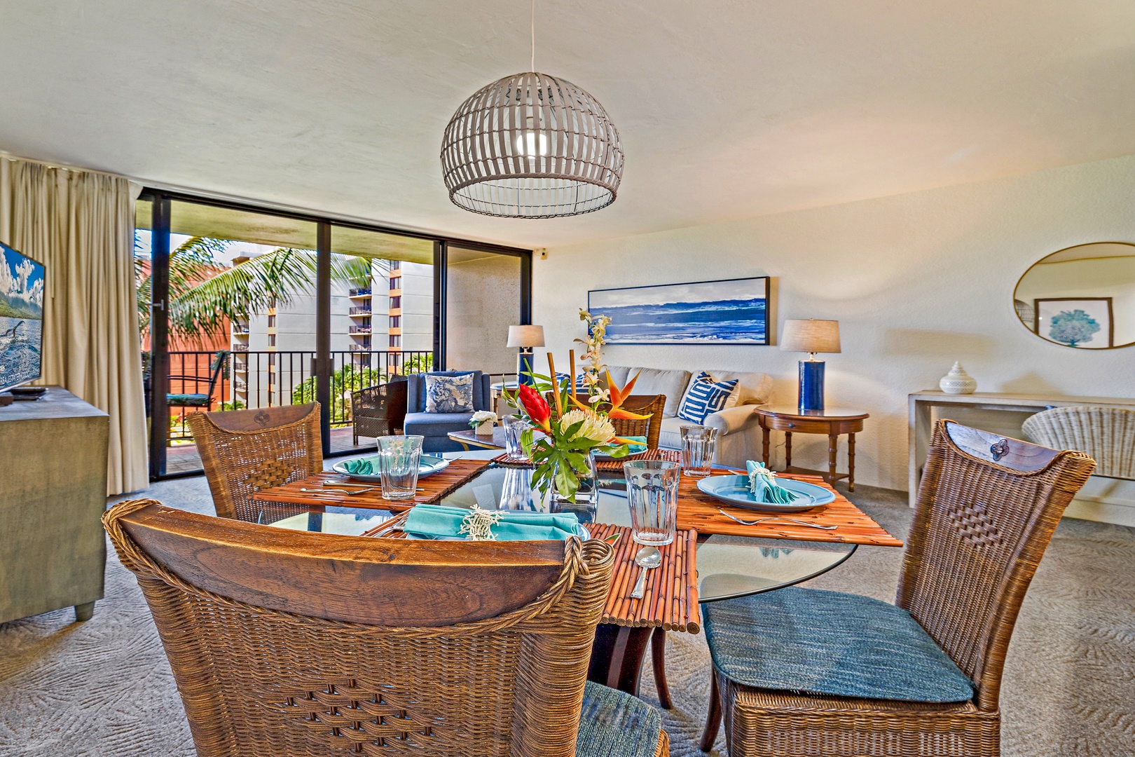 Lahaina Vacation Rentals, Kaanapali Shores 544 - This beautifully set dining area with wicker chairs invites you to enjoy meals together while taking in the ropical views just outside the large windows