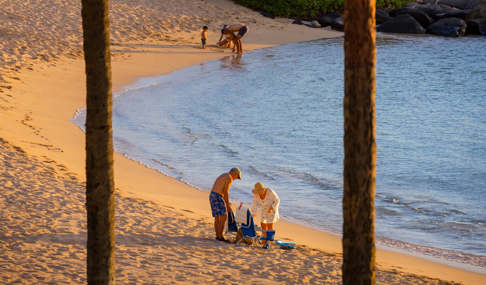 Kapolei Vacation Rentals, Ko Olina Beach Villas B210 - Families enjoying the gentle lagoon waters.