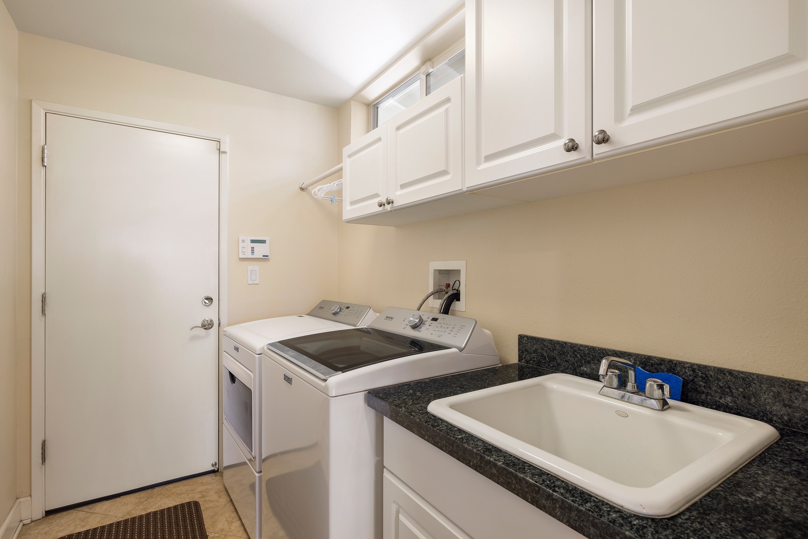 Your dedicated laundry room features full-size washer and dryer with convenient utility sink for all your cleaning needs.