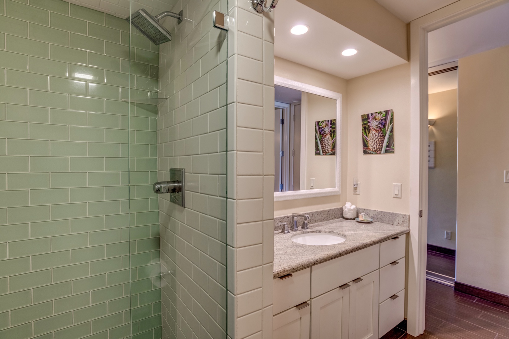 Lahaina Vacation Rentals, Papakea B-105 - This modern bathroom features a glass-enclosed shower with sleek tilework, creating a spa-like atmosphere