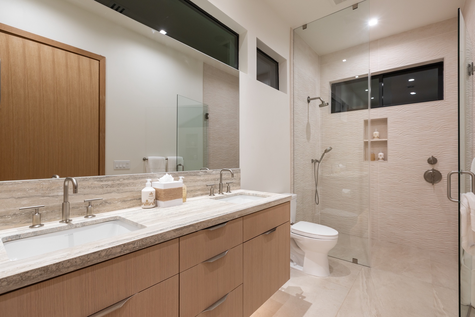 Kamuela Vacation Rentals, 5BD Mauna Lani Lux Ocean Estate (OE12) at One Ocean - Unwind in your luxurious marble bathroom featuring dual sinks, glass shower, and modern finishes for ultimate relaxation.
