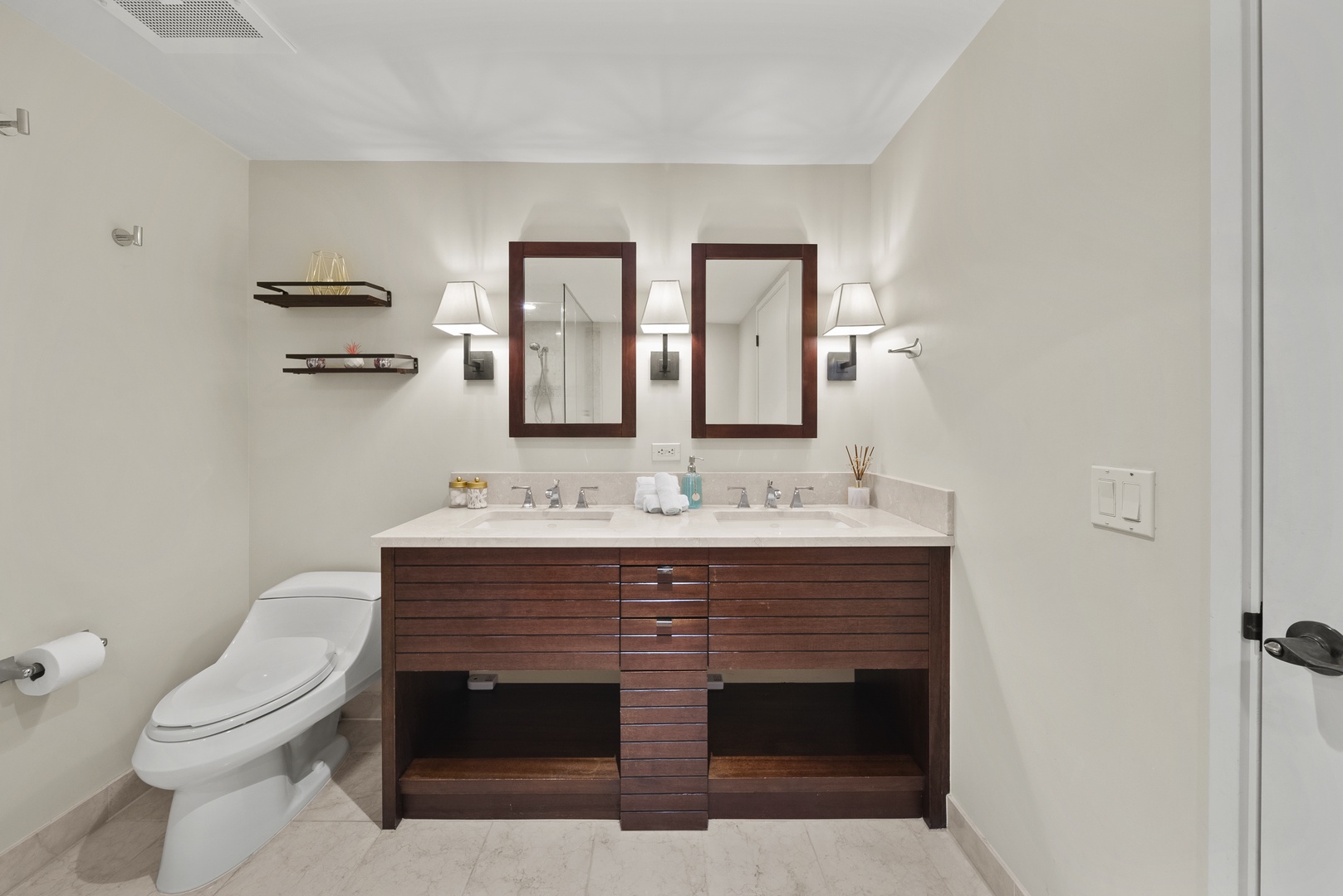 Honolulu Vacation Rentals, Watermark Waikiki Unit 901 - A chic and spacious ensuite bathroom for the primary guest bedroom.