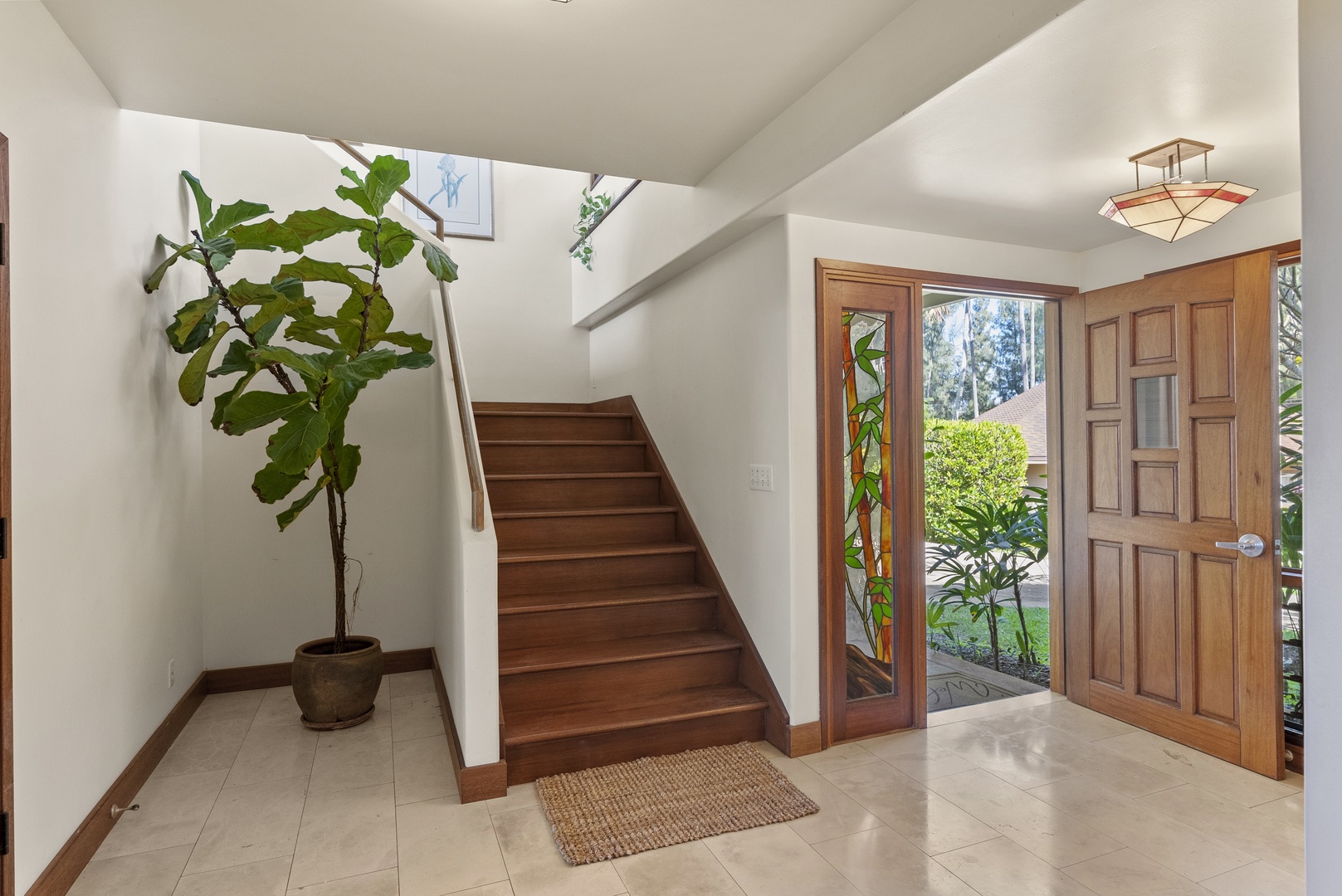 Haleiwa Vacation Rentals, Maluhia Beach House - A warm and inviting entryway with tropical greenery, welcoming you to your island retreat.