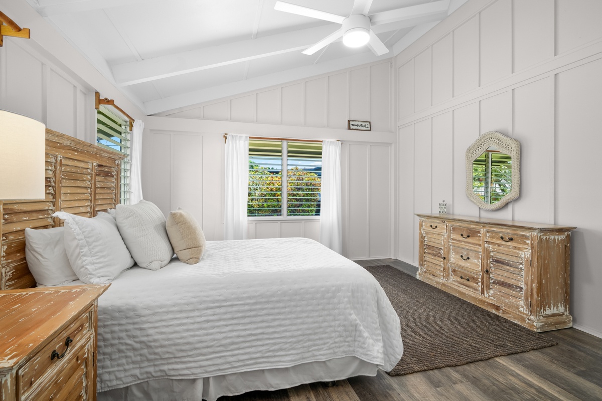 Hanalei Vacation Rentals, Hale Kanani (Kaua'i) TVNC 1342 - White bedding under a vaulted plank ceiling, the guest room bright and uncomplicated.