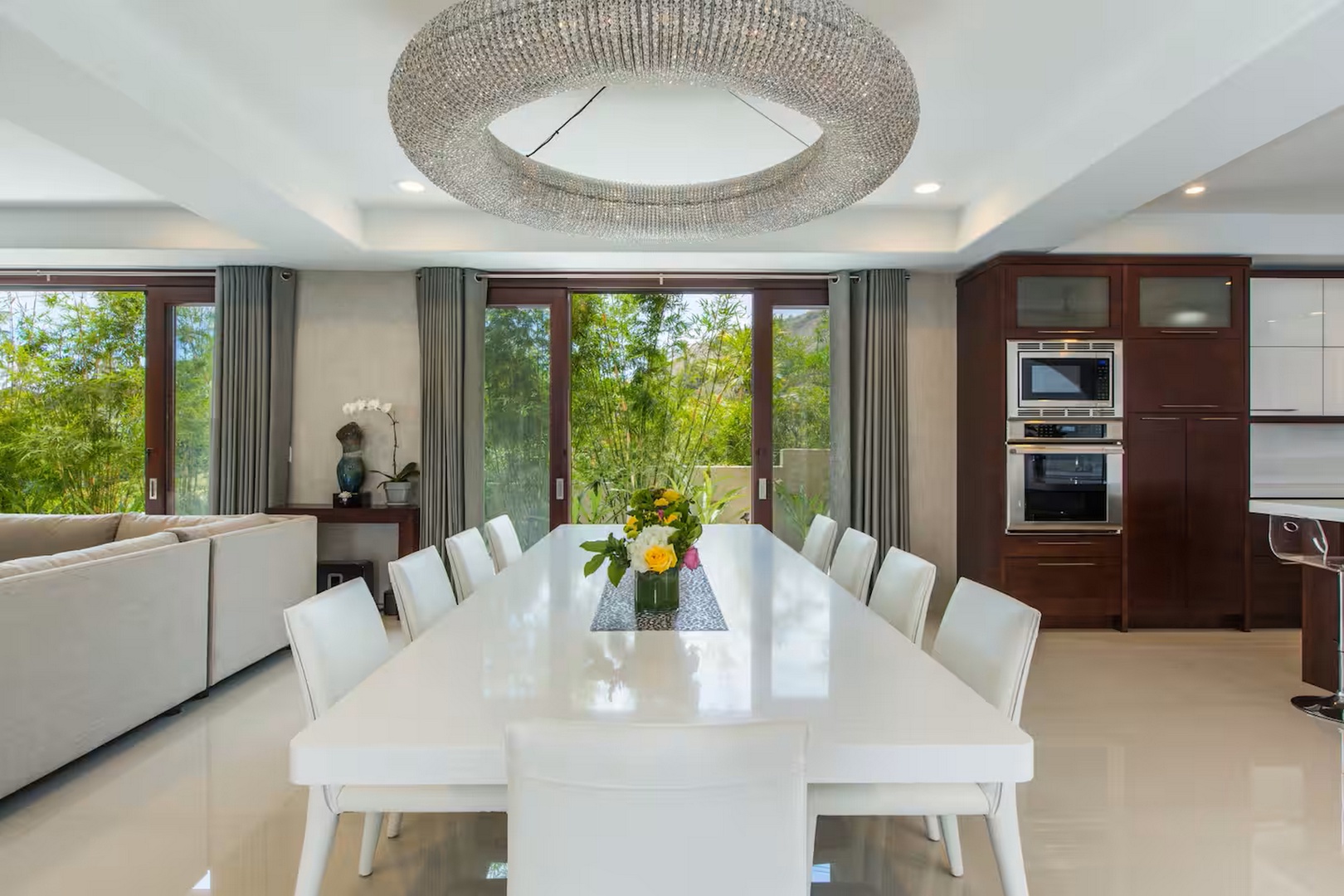 Honolulu Vacation Rentals, Diamond Head Beachfront Estate 9BR - One long table and a sculptural chandelier gather the whole group for dinner.