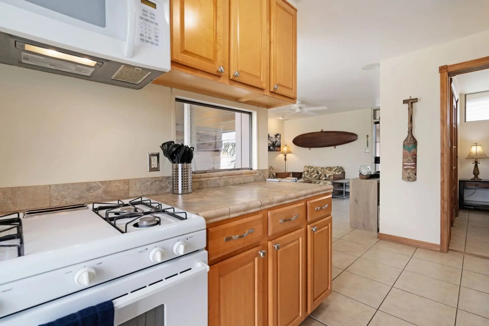 Kihei Vacation Rentals, Kalama Terrace P302 - Cook here and you're still part of the conversation, thanks to the pass-through window over the stove.