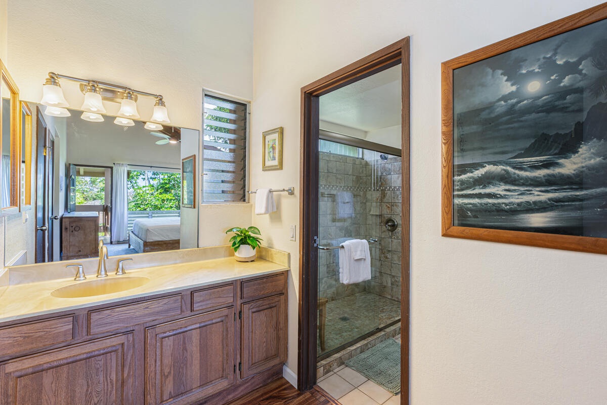 Princeville Vacation Rentals, Hale Ohana Ho'omaka - Ensuite bathroom with dual vanity and step-in shower. Well-lit and stocked with essentials.