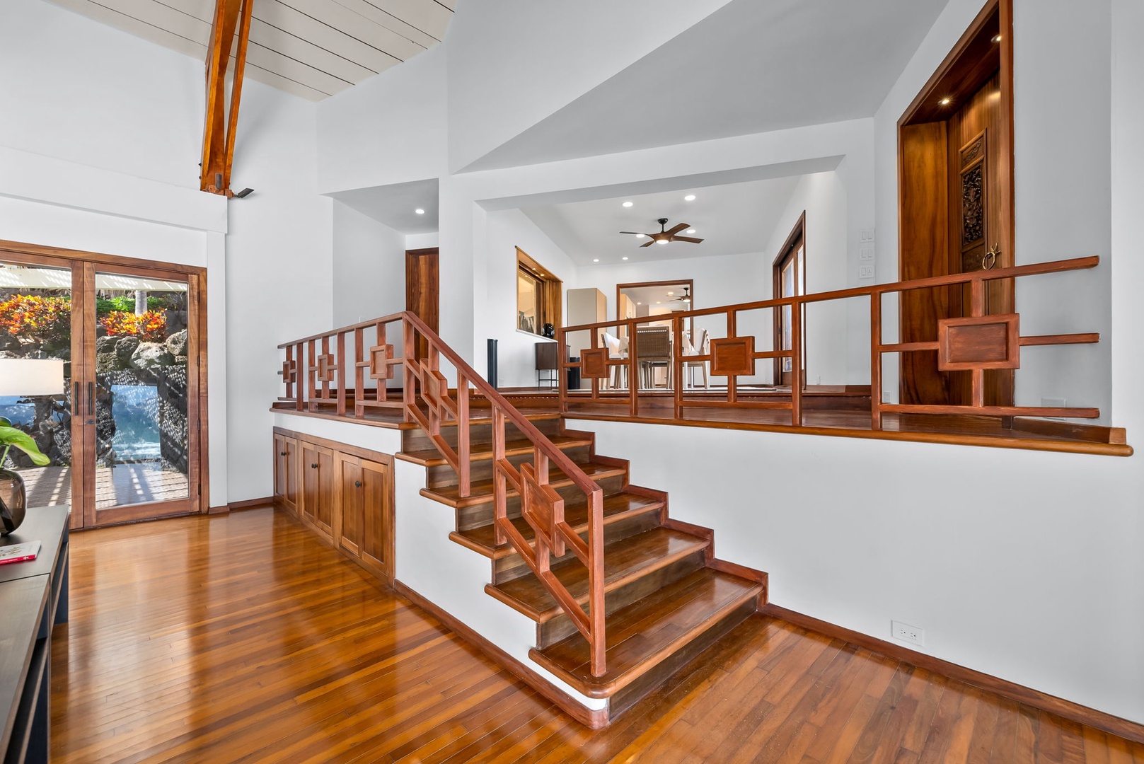 Honolulu Vacation Rentals, Black Point Ocean Villa - Warm wood floors and elegant railings create your welcoming entrance, with rich tropical hardwood details throughout this stunning multi-level home.