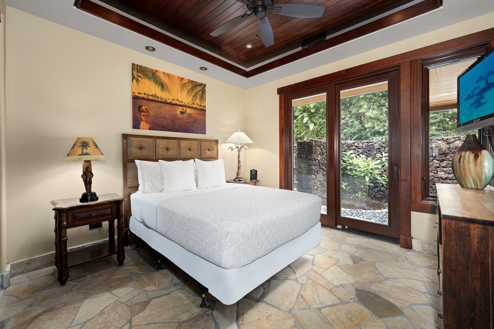 Kamuela Vacation Rentals, Hale Konane - Wake up to lush garden views in this peaceful queen suite with private lanai access and natural light.