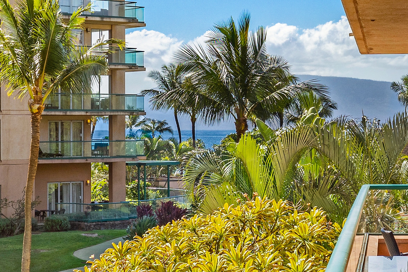 Lahaina Vacation Rentals, Honua Kai Konea 206 - Tropical foliage and palm trees frame the beautiful ocean view, creating a serene backdrop for your stay.