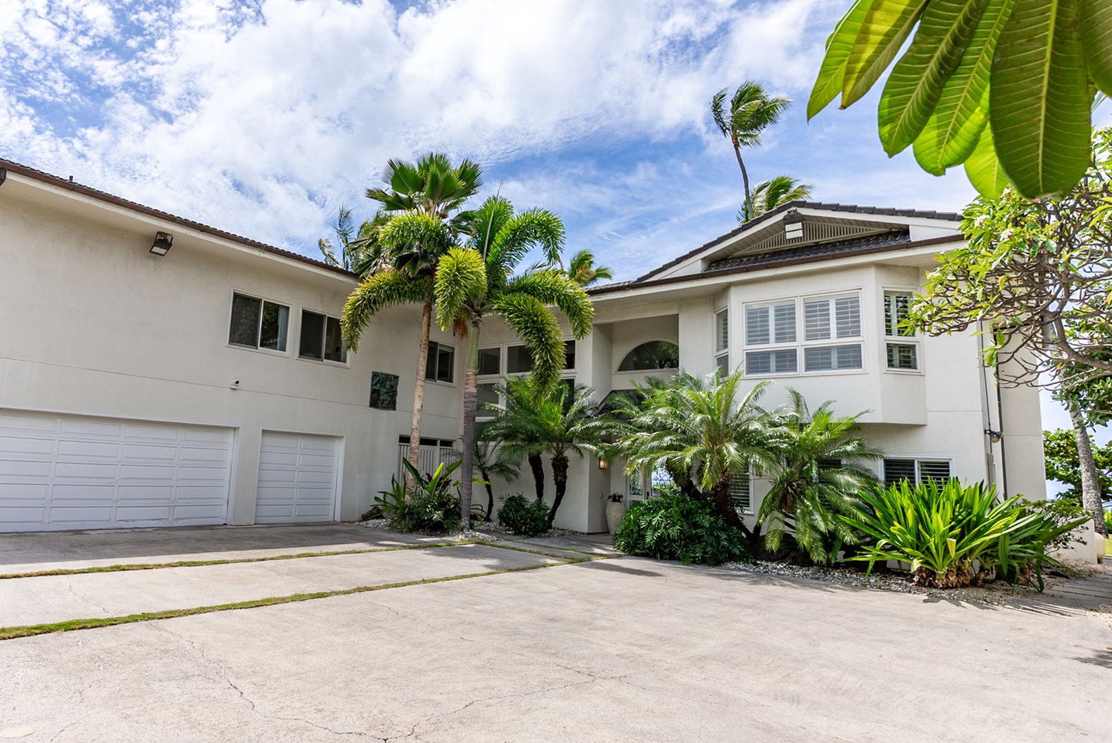 Honolulu Vacation Rentals, Paradise Beach Estate - Arrive in style through the gated entry to this stately residence with a 3-car garage, manicured landscaping, and ample parking.