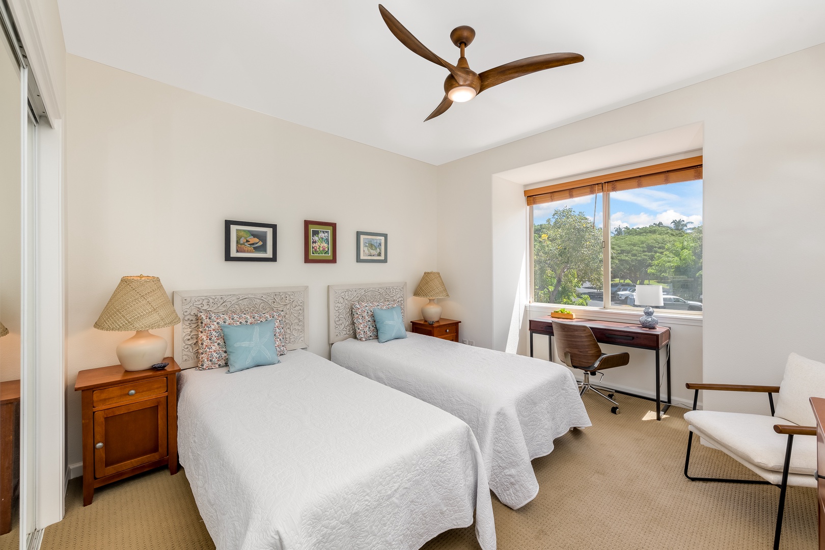 Kamuela Vacation Rentals, Mauna Lani Fairways #603 - XL twin beds, feels both intimate and airy. A workspace window nook provides a desk and a lovely view out over the treetops.