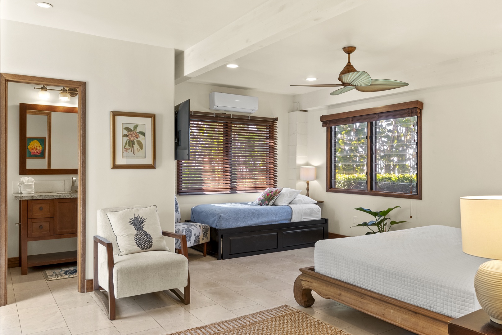 Haleiwa Vacation Rentals, Maluhia Beach House - Expansive suite featuring a king bed, and twin trundle beds for guests.